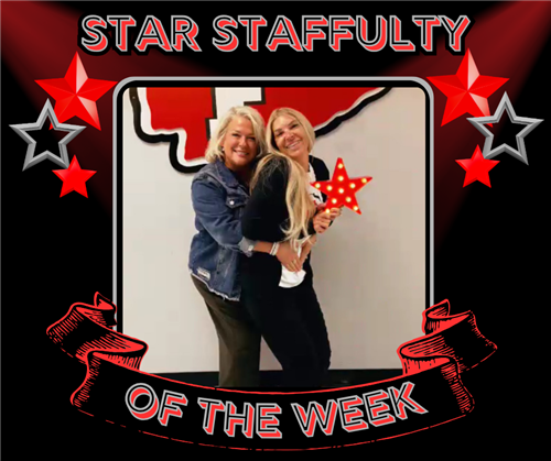 Two blonde ladies pose with the red star, one hugs the other from behind.